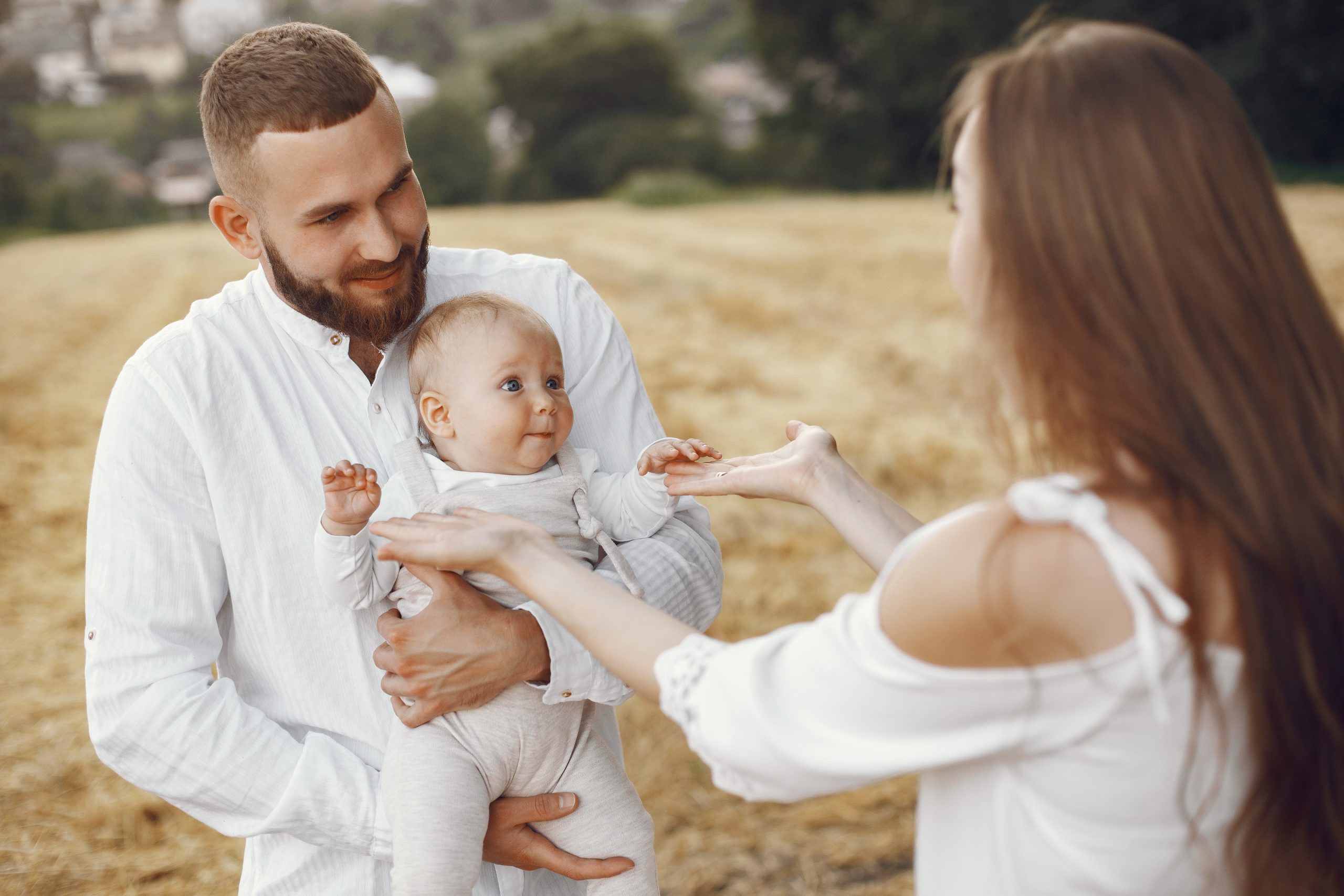 family spend time in a summer field