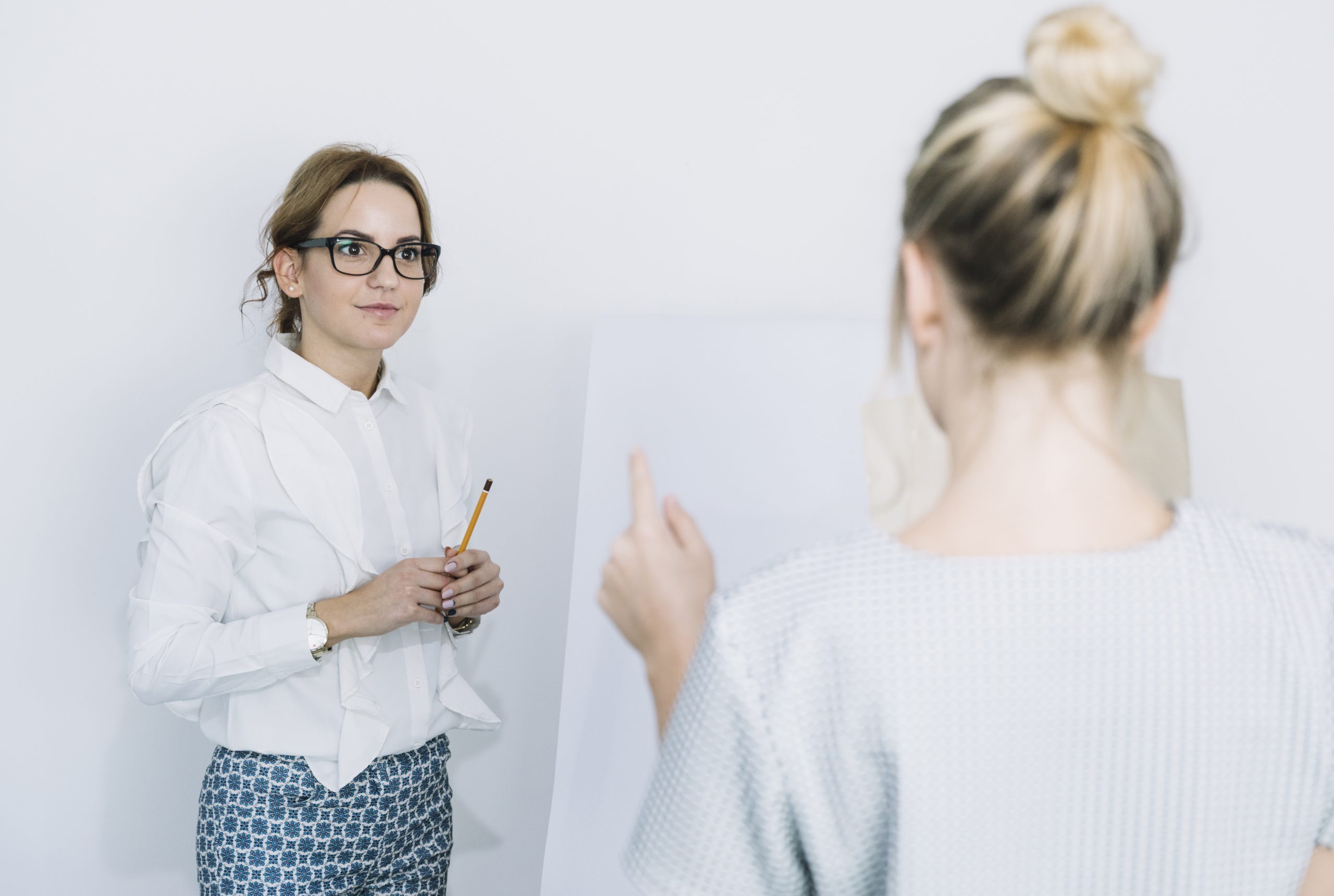 colleague discussing planning work meeting