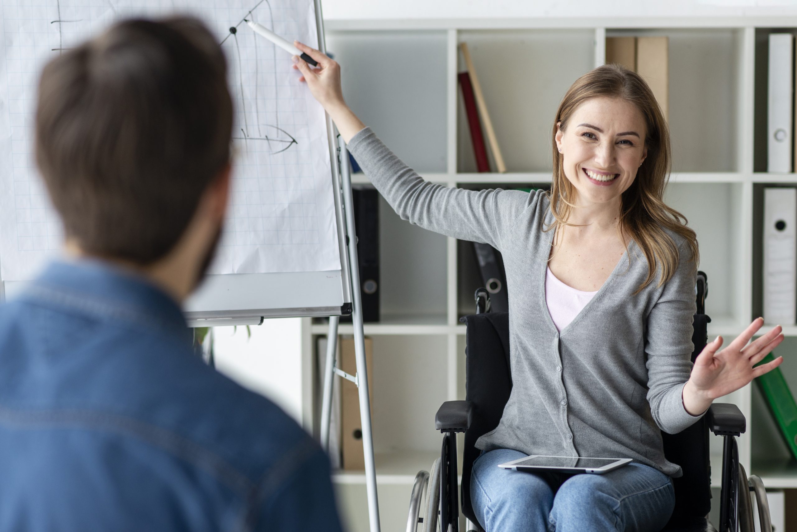 positive young woman presenting project