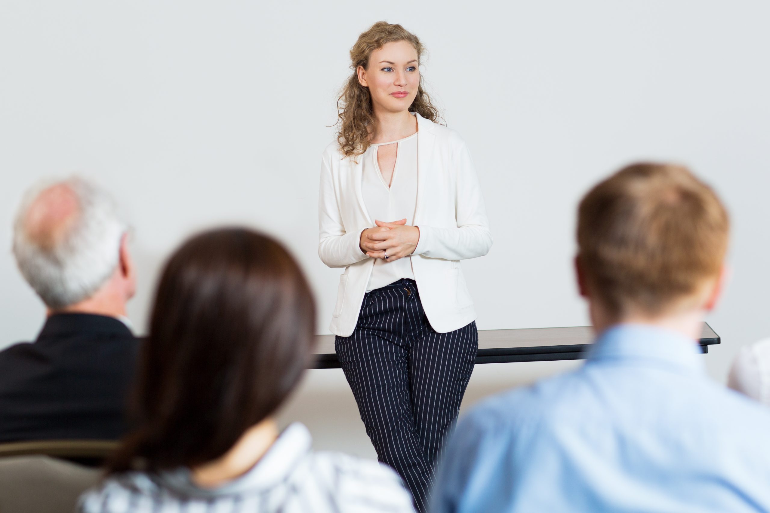 young female businesswoman holding report